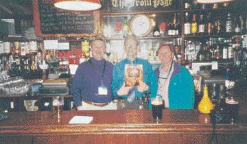 Drs. Peter Kyle and Doug Caine of London, ON, share a pint and their copy of Oral Health with the owner of 'The Front Page' Pub, John Michael Hatton, in Belfast, Northern Ireland. Mr. Hatton's niece, Jackie Duffy, is Dr. Kyle's former dental assistant. Aha!