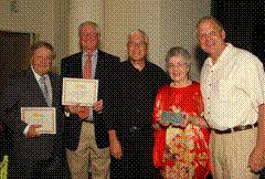 Pictured l-r: Retiring Museum Board members Dr. Stanley Block and Terry Smith, Board Chair Dr. Leslie Seldin, retiring staff member Elza Dunning and Executive Director Jonathan Landers.