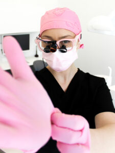 Irene wearing Yeoman Loupes by Designs for Vision and Toothlife Scrub cap