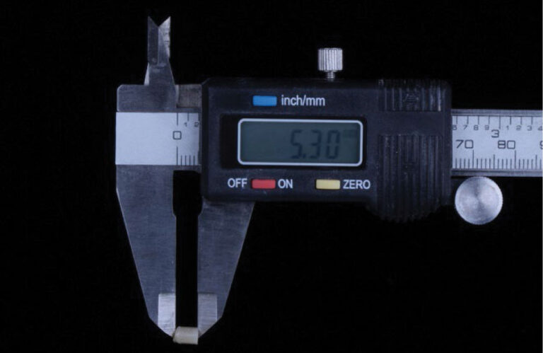 Length of cured composite measured and divided by 2 in order to calculate depth of cure of the resin specimen. 