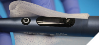 Disinfecting the LCU between patients using the LCU manufacturer-recommended disinfectant wipe.