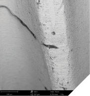 SEM images in 500x and 2,500x with EDS analysis result showing significant carbonaceous contamination on the laser-treated implant shoulder (US-made implant system). 