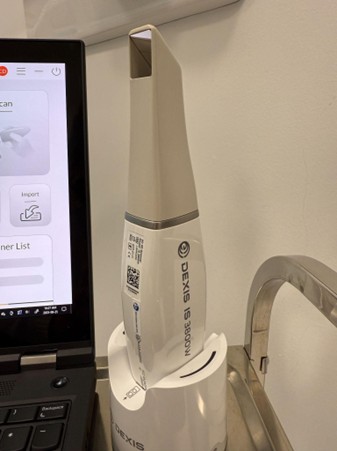 The DEXIS IS 3800WⓇ (DEXIS, Hatfield, PA, USA) intraoral scanner used at Chrysalis Dental Centres for layered scan acquisition. The wireless handheld unit enables efficient, reproducible capture of full-arch surface data.