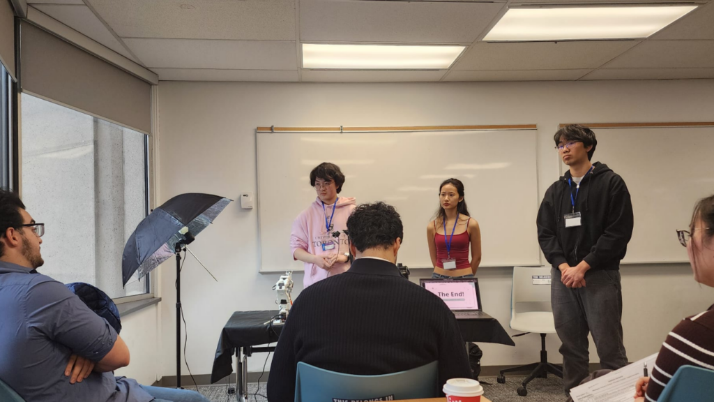 The second-place team presents its “Auto-Sucker 3000” prototype during the SmileHacks bioengineering competition. (Photo: Oral Health Group)