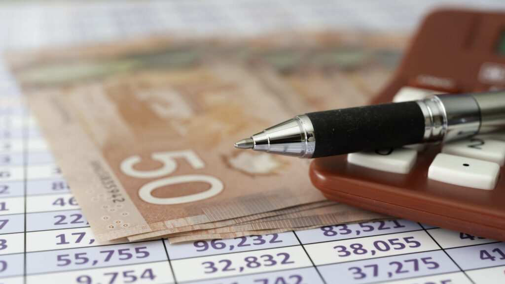 Canadian Dollar Notes on spreadsheet with Calculator - Calculate profits